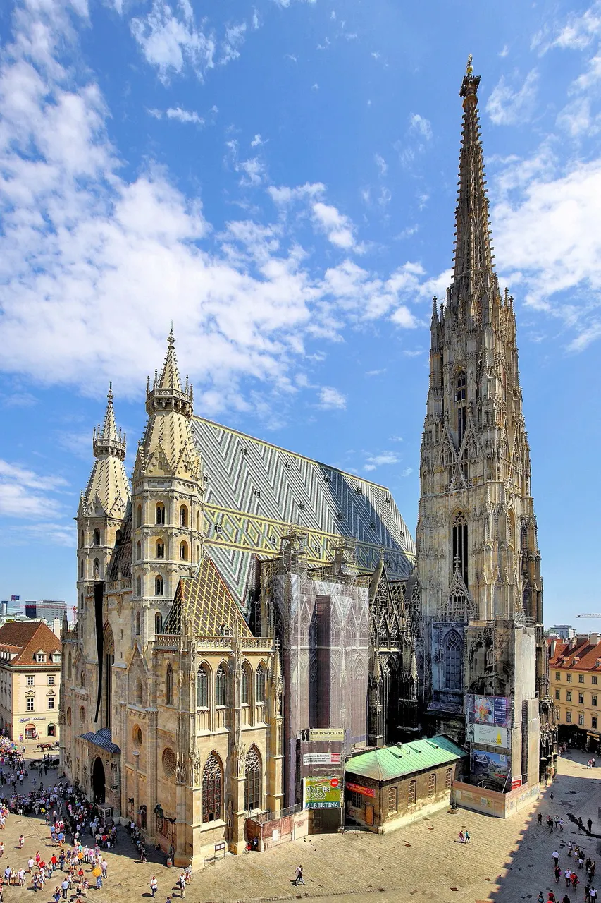 St Stephen's Cathedral in Vienna, seen from the west, with its tall Gothic tower and colourful tiled roof.