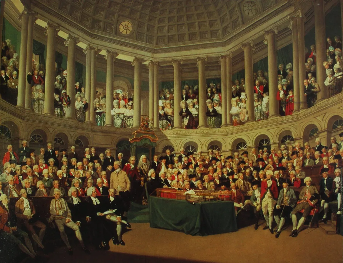 Painting of a parliamentary session in a circular chamber, with full benches, columns, a gallery and the speaker beneath a canopy.