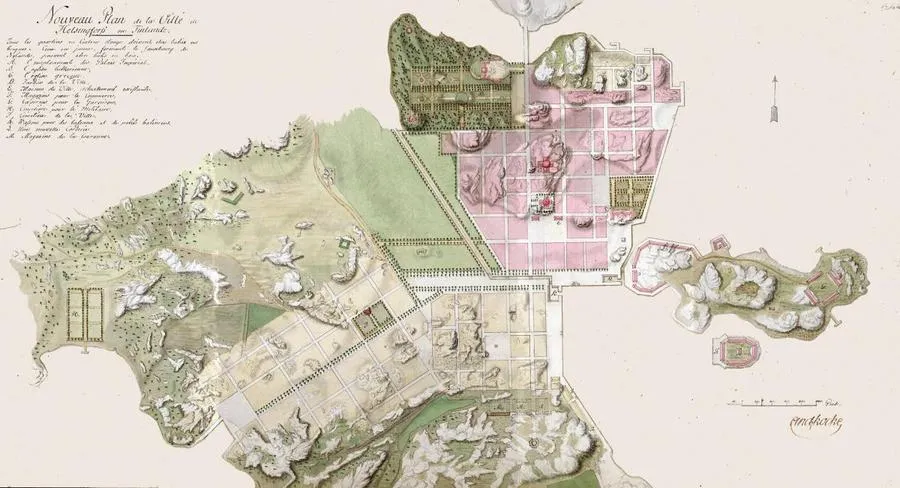 Planta colorida de ruas, quadras e áreas de água, com legenda à esquerda e assinatura junto à borda inferior.