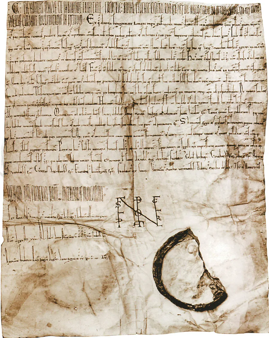 Fac-símile integral de um documento medieval, com linhas em latim, monograma imperial e sinais de autenticação.